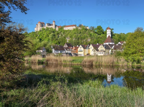 Castle and old town with St Barbara's Church reflected in the River Wörnitz, Harburg, Donau-Ries, Swabia, Bavaria, Germany