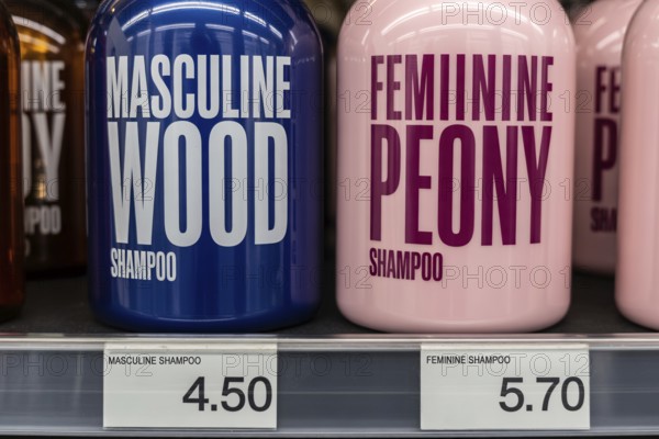 Close-up of blue and pink shampoo bottles with unequal prices. Visual concept of the pink tax. Generative ai, AI generated