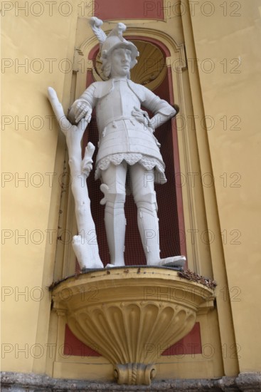 Sculpture of the giant Thyrsus, legendary figure, at the entrance portal of Wilten Abbey, Klostergasse 7, Wilten, Innsbruck, Austria