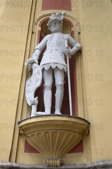 Sculpture of the giant Haymon, founder of the monastery, at the entrance portal of Wilten Abbey, Klostergasse 7, Wilten, Innsbruck, Austria