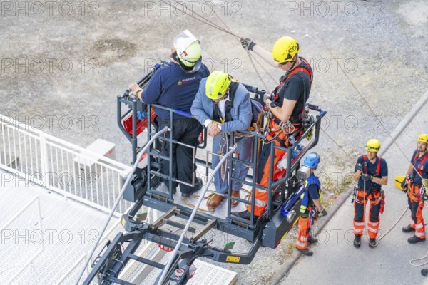 Teams during rescue exercise on platform at height, fire brigade exercise for gondola rescue, Germany