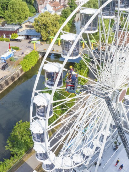 Aerial view of Ferris wheel and emergency services, fire brigade exercise for gondola rescue, Germany