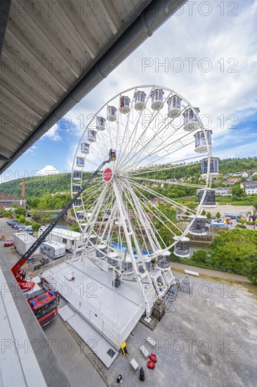 Wide angle view of a large Ferris wheel next to an urban environment, fire brigade exercise for gondola rescue Ferris wheel, Calw, Germany