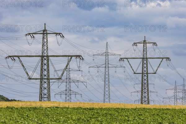 Many high-voltage power lines and lattice towers in the district of Ludwigsburg near Besigheim, Baden-WÃ¼rttemberg, Germany
