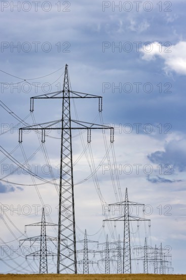 Many high-voltage power lines and lattice towers in the district of Ludwigsburg near Besigheim, Baden-WÃ¼rttemberg, Germany