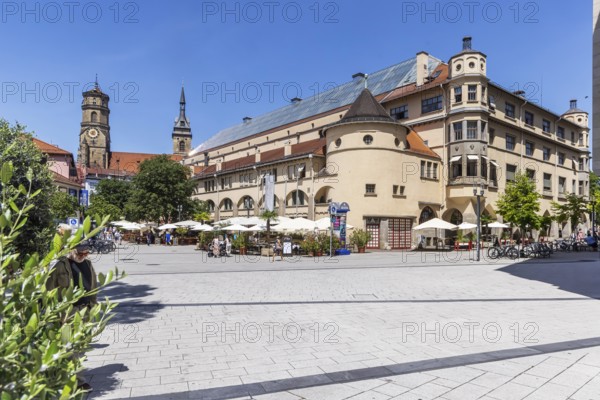 Stuttgart market hall in Art Nouveau architectural style. Food market in the upper price segment. Next to it the two towers of the collegiate church. Stuttgart, Baden-WÃ¼rttemberg, Germany