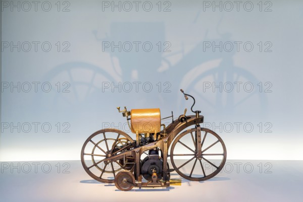 Daimler riding carriage from 1885 with an output of 0.5 hp. The Mercedes-Benz Museum in Stuttgart presents a journey through the automotive history of the global corporation. The history of the Mercedes star begins with the first automobile in 1886. 160 vehicles are on display. Stuttgart, Baden-WÃ¼rttemberg, Germany