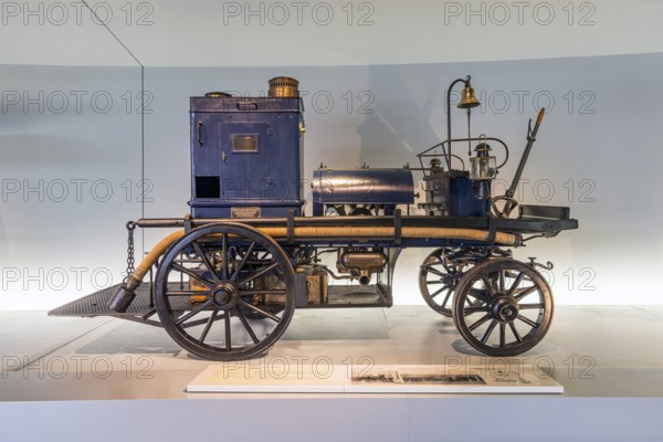 Daimler motorised fire engine from 1892. The Mercedes-Benz Museum in Stuttgart presents a journey through the automotive history of the global corporation. The history of the Mercedes star begins with the first automobile in 1886. 160 vehicles are on display. Stuttgart, Baden-WÃ¼rttemberg, Germany