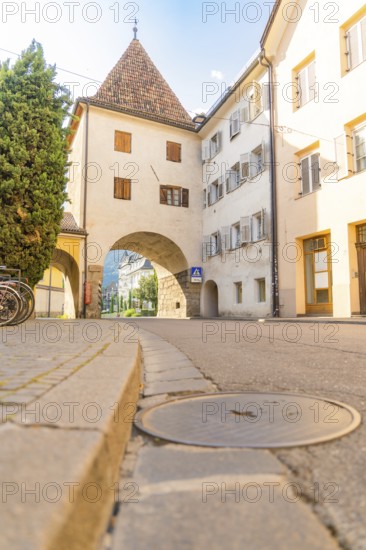Historic old town centre with archway and cobbled street, peaceful and quiet atmosphere, Merano, South Tyrol, Italy