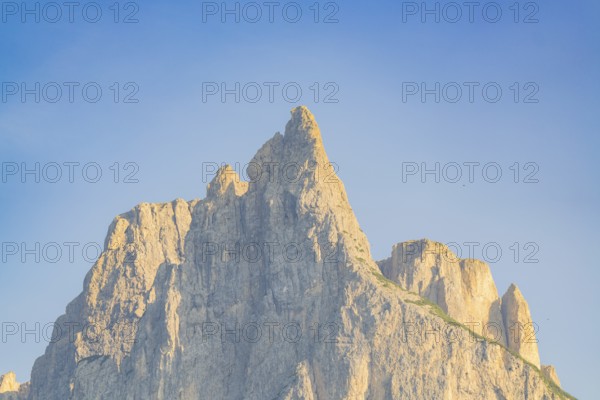 Impressive mountain peak in front of a clear blue sky, Alpe di Siusi, Dolomites, South Tyrol, Italy
