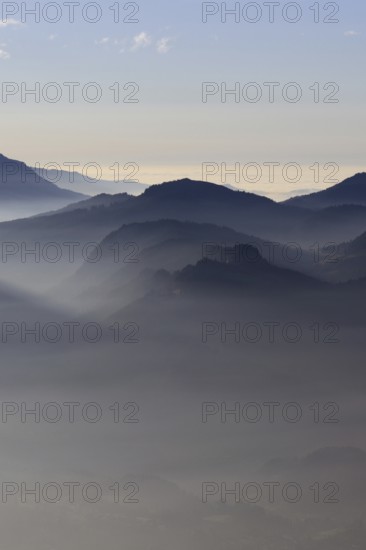 Mountain silhouettes... Alpine peaks and mountain ranges in the Bavarian Alps, light fog rises from the valleys, which creates an idyllic atmosphere in the light of the low sun, romantic view from Oberstdorf towards Kleinwalsertal, local nature, Bavaria, AllgÃ¤u, AllgÃ¤u Alps, Bavarian, Germany, Western Europe