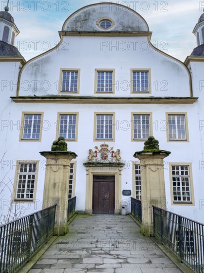 View over fortified bridge over moat moat of Borbeck Castle former summer residence of prince abbesses, Essen, North Rhine-Westphalia, Germany