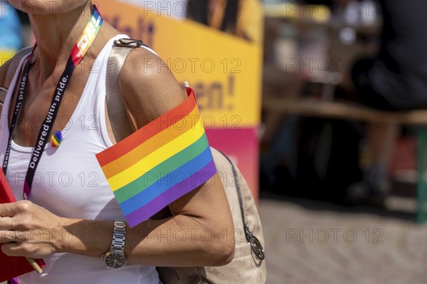 Participant with rainbow flag at Christopher Street Day in Leipzig on 28 June 2025