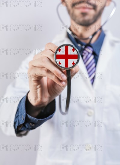 Georgia health and medical insurance concept. Georgia healthcare system, doctor holding stethoscope
