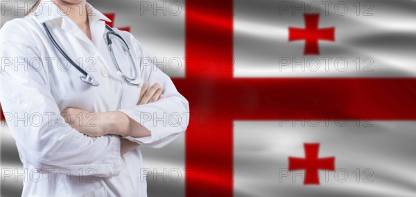 Doctor with crossed arms on Georgia flag. Georgia health and care concept. Female doctor on Georgia flag