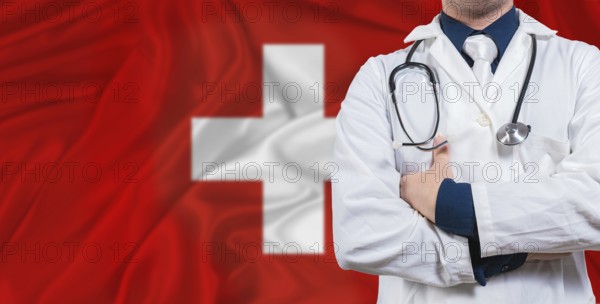 Male doctor with stethoscope on Switzerland flag. Doctor holding stethoscope on Switzerland flag