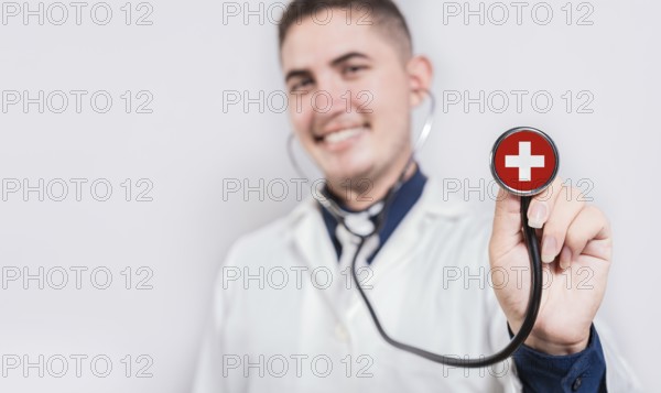 Doctor showing stethoscope with Switzerland flag. Switzerland national healthcare concept