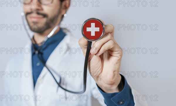 Doctor holding stethoscope with Switzerland flag. Switzerland health and care concept, Switzerland flag on stethoscope