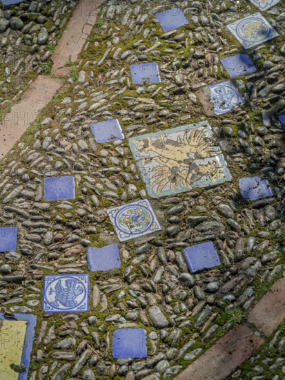 Street paving made of pebbles and tiles background, texture, Andalusia, Spain