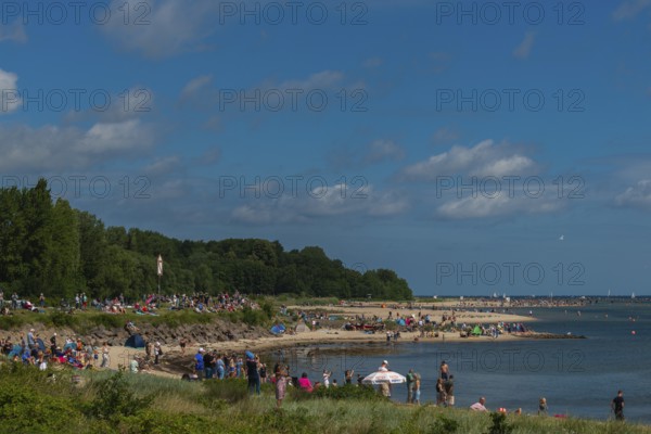 Spectators of the windjammer parade 2025 on the Kiel Fjord at the end of the Kieler Woche, tall ships, Falkensteiner beach life, bathing pleasure, lighthouse, summer weather, sunshine, forest, Kiel, Schleswig-Holstein, Germany