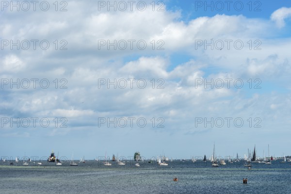 Windjammer Parade 2025 on the Kiel Fjord at the end of Kiel Week, tall ships, three-masters, spectators, Falkensteiner Strandleben, lighthouse, summer weather, sunshine, forest, Kiel, Schleswig-Holstein, Germany