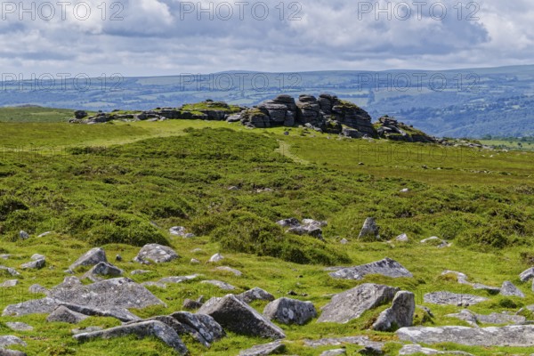 Stones and landscape at the top Tor tor rock hill in Dartmoor National Park. Widecombe-in-the-Moor, Bovey Tracey, Devon, South England, Great Britain