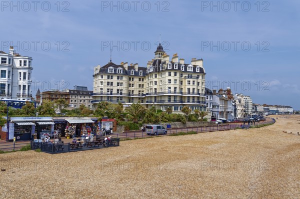 Beach and building on the seafront in Eastbourne, seaside resort on the English Channel, in the county of East Sussex, England, United Kingdom of Great Britain