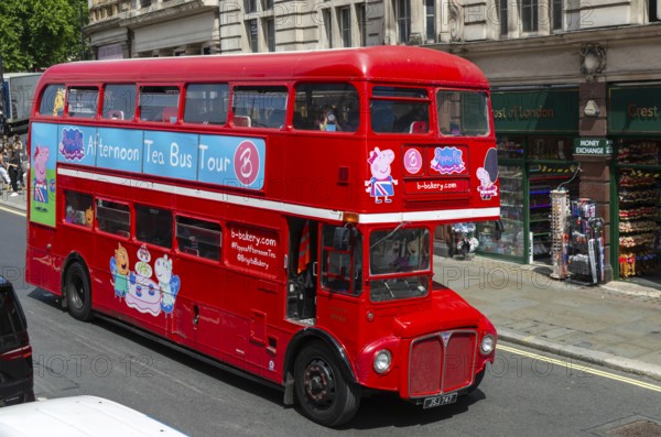 Red Routemaster double decker bus, Brigit's Bakery sightseeing tour bus, Parliament Street, Whitehall, London, England, UK