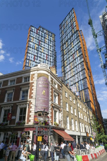 Tower block apartments of One Crown Place rise high above older properties, Sun Street, City of London, England, UK - The Flying Horse pub