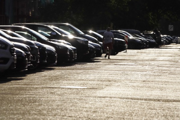 Symbolic image of man and technology, cars and pedestrians, summer, Germany