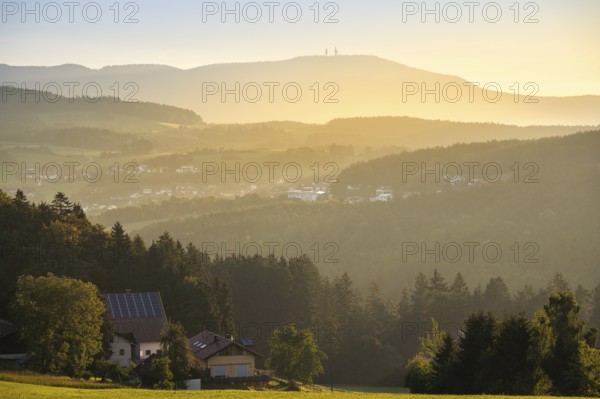 View from the Rossberg to the Hohenbogen (High Arch), landscape with forest, meadows and mountains around the town of Bad Kötzting. In the morning at sunrise. District of Cham, Upper Palatinate, Bavarian Forest, Bavaria, Germany