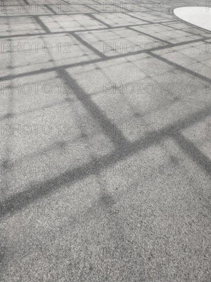 Roof construction casts shadows on the ground, Olympic Park, Munich, Bavaria, Germany