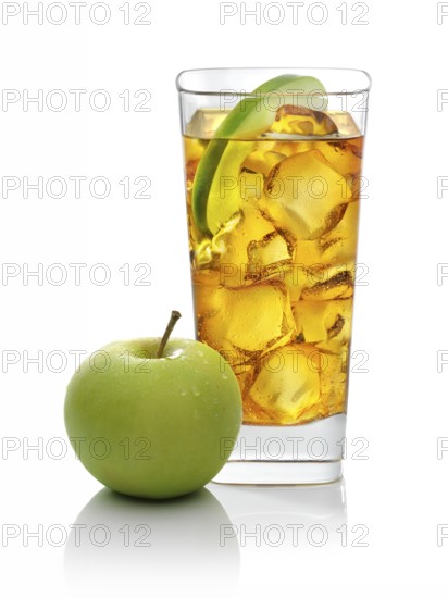 Cocktail in a long drink glass on ice with half an apple slice and apple as garnish against a white background, studio shot