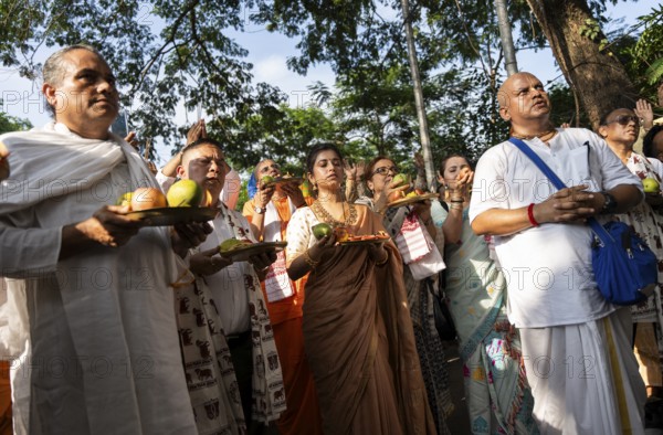 Hindu devotees offer prayers as they takes part in Rath Yatra religious procession Guwahati, India on June 27, 2025. Rath Yatra, also known as the Chariot Festival, is a major Hindu festival celebrated in India