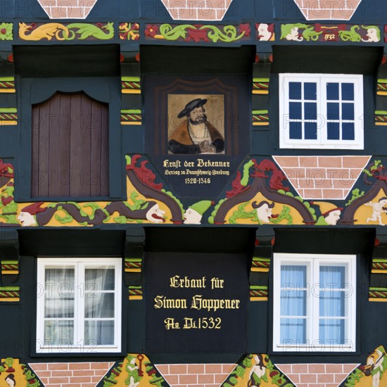 Hoppenerhaus, the most magnificent half-timbered house in the historic centre of Celle with a picture of Duke Ernst the Confessor, detail with painted wood carvings, Celle, Lower Saxony, Germany