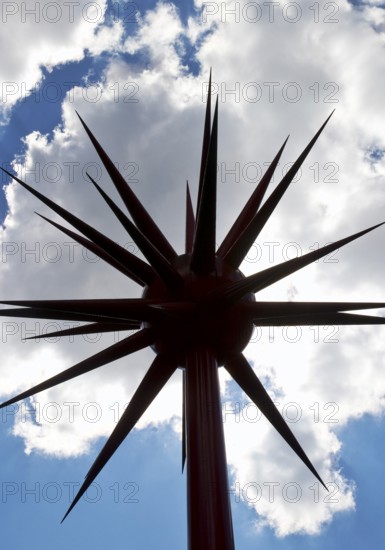 Work of art by Otto Piene entitled Fireworks for Celle as a silhouette against the light in front of clouds, Lower Saxony, Germany