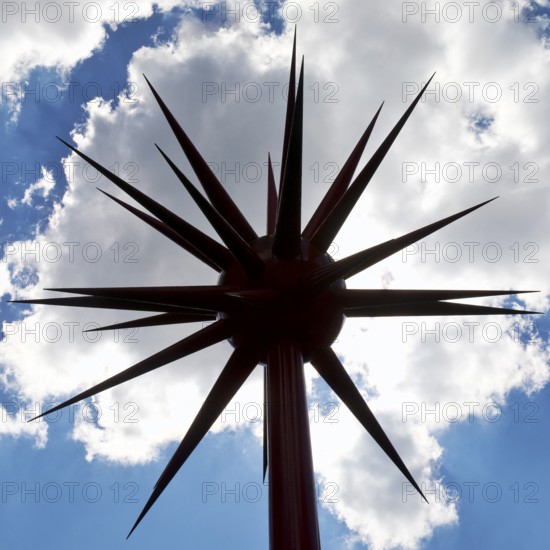 Work of art by Otto Piene entitled Fireworks for Celle as a silhouette against the light in front of clouds, Lower Saxony, Germany