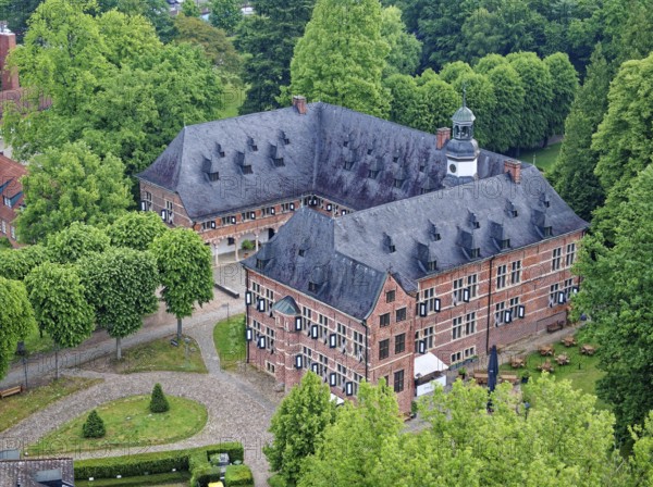 Reinbek Castle, one of the secondary residences of the ducal house of Schleswig-Holstein-Gottorf, was built in the 16th century in the Renaissance style and today serves as the town's art and cultural centre. Aerial view. Reinbek, Schleswig-Holstein, Germany