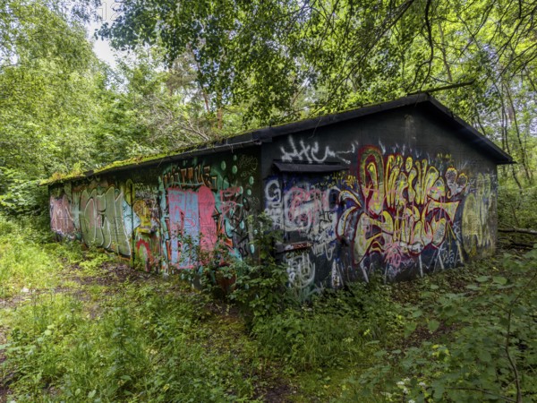 Abandoned military building in the forest, full of graffiti, in Ystad, SkÃ¥ne County, Sweden, Scandinavia