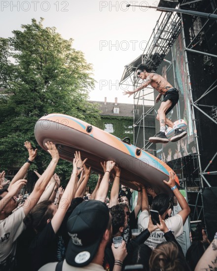 Remington Leith, singer of Palaye Royale jumps into an inflatable boat live at Zitadelle Spandau, Berlin, 21/06/2025
