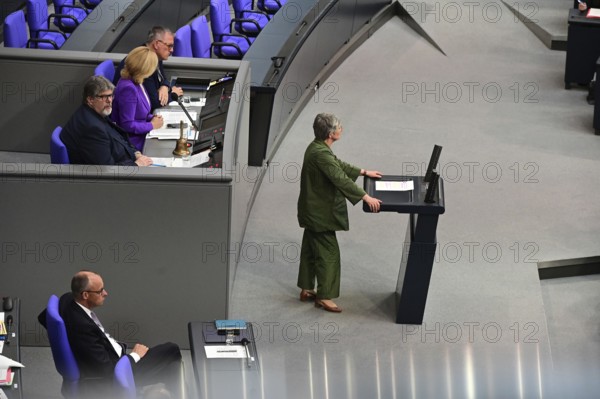 Federal Chancellor Friedrich Merz (CDU) and parts of his cabinet sit on the government bench, whilec, co-chair of the Greens parliamentary group, responds to the Federal Chancellor's government statement