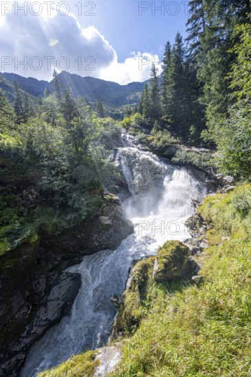 Waterfall on a roaring mountain stream, Seebach stream in the Burkhardklamm gorge, Ridnauntal valley, South Tyrol, Italy