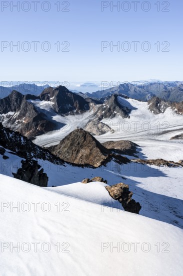 Snow on the Wilder Freiger mountain peak, picturesque high mountain landscape, view of Ãœbeltalferner glacier and rocky mountain peaks Königshofspitz and Sonklarspitze, Stubai Alps, South Tyrol, Italy