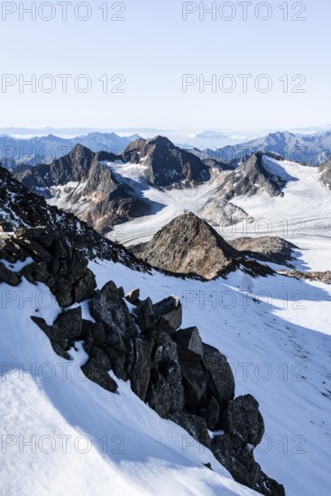 Snow on the Wilder Freiger mountain peak, picturesque high mountain landscape, view of the Ãœbeltalferner glacier and rocky Königshofspitz mountain peak, Stubai Alps, South Tyrol, Italy