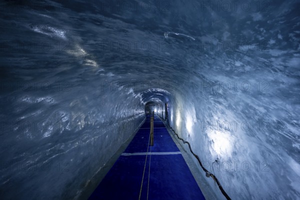 Artificial ice cave through the glacier ice, Mer de Glace, Montenvers, Chamonix, Haute-Savoie, France