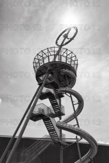 Slide, Vitra Slide Tower made of steel with viewing platform and large clock, monochrome, sunbeams, artist Carsten Höller, Vitra Campus, Vitra Design Museum, Weil am Rhein, Baden-WÃ¼rttemberg, Germany