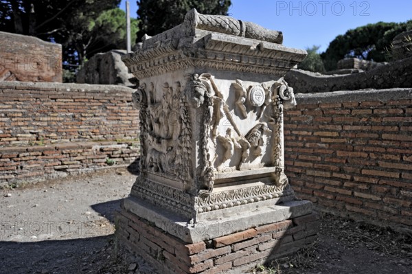 Relief on the sacred altar of Romulus and Remus, Sacello dell' Ara di Romolo e Remo, angel, chariot, stone carving, remains, ruins, ancient port city of Rome, excavation site Archaeological Park Ostia Antica, metropolitan city of Rome, Lazio, Italy