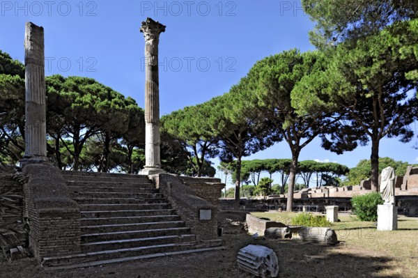 Ruins of the Tempio di Cerere, temple of the goddess Ceres, remains, podium temple with staircase and columns, Piazzale delle Corporazioni, ancient port city of Rome, excavation site Archaeological Park Ostia Antica, metropolitan city of Rome, Lazio, Italy