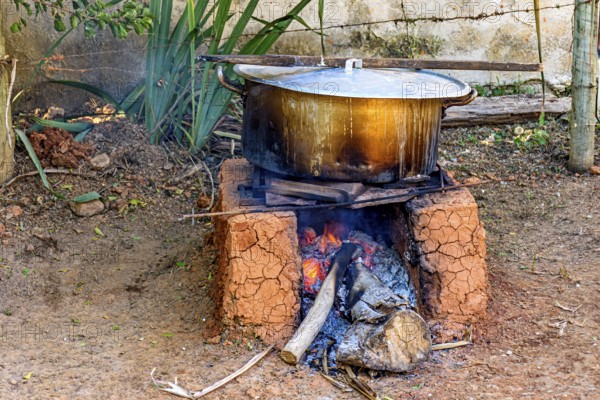 Food being prepared in the backyard on a wood-burning stove typically used in Minas Gerais, Brazil, Minas Gerais, Brazil