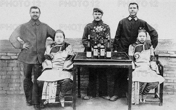 Group photo of Austrians with Chinese woman, China around 1900